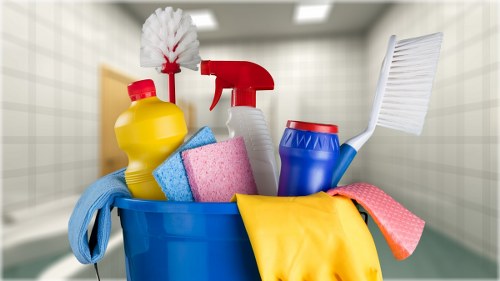 Cleaner preparing carpet cleaning equipment with safety awareness