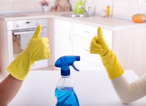 Team reviewing ethical compliance documents in a cleaning business setting